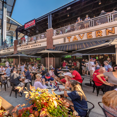 People eating outside of the Tavern